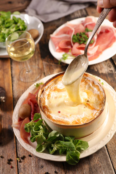 istock mont d'or, cheese melted with potato and ham 1058277858