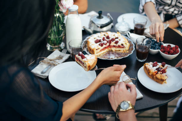 istock Group of people having breakfast together 1058284820