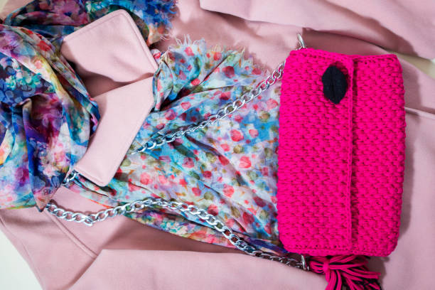 istock Pink knit bag on a pink coat. 1058285470