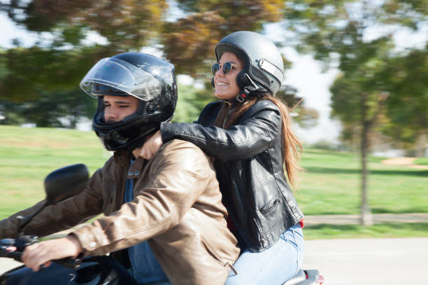 istock Young couple riding motorcycle 1058285848