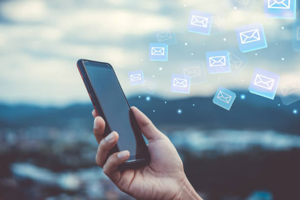 istock Woman hand using smartphone to send and recieve email. Business communication  technology concept. 1058288468