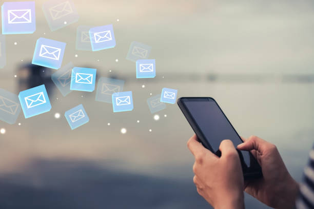 istock Woman hand using smartphone to send and recieve email. Business communication  technology concept. 1058288480
