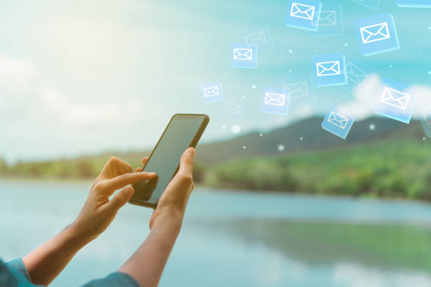 istock Woman hand using smartphone to send and recieve email. Business communication  technology concept. 1058288492