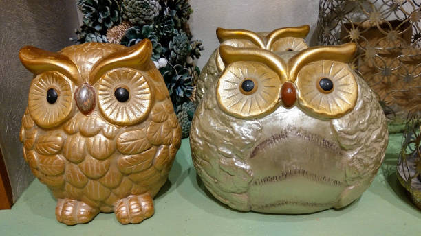 istock Two cute ceramic owl near christmas tree 1058288866
