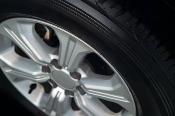 istock closeup alloy car wheels with soft-focus and over light in the background 1058291008