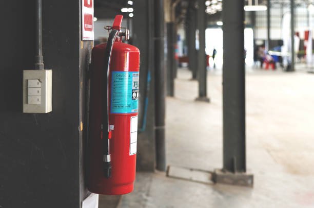 istock closeup red fire extinguisher with soft-focus and over light in the background 1058291058