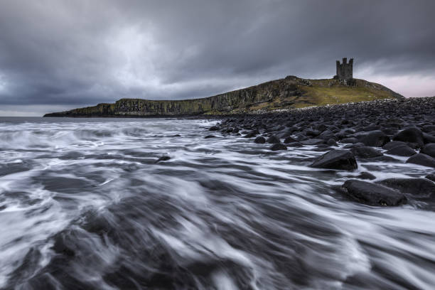 istock Dunstanburgh Castle ruins on the Northumberland coastline 1058293588