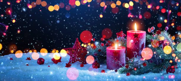 istock Christmas Decorations With Candles and Colored Lights Effects 1058293846