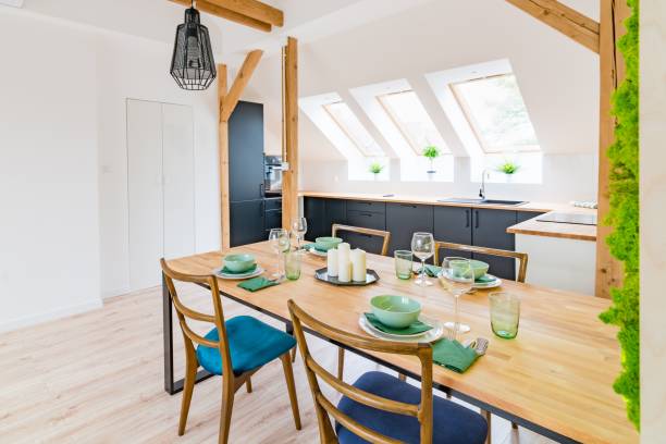 istock Wooden set table and modern kitchen in the attic 1058294306