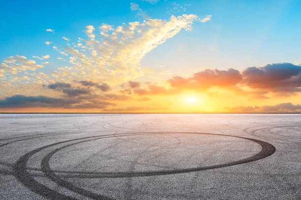 istock Car racing track square and sky beautiful clouds scenery 1058298734
