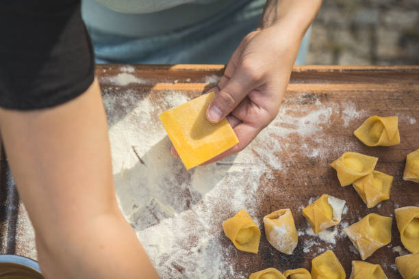 istock chef preparing handmade stuffed pasta tortellini 1058299294