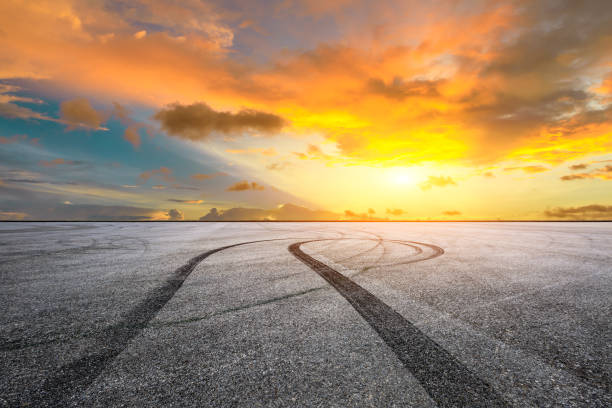 istock Car racing track square and sky beautiful clouds scenery 1058300088