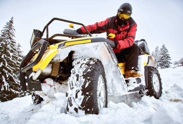 istock Winter race on an ATV on snow in the forest. 1058302058
