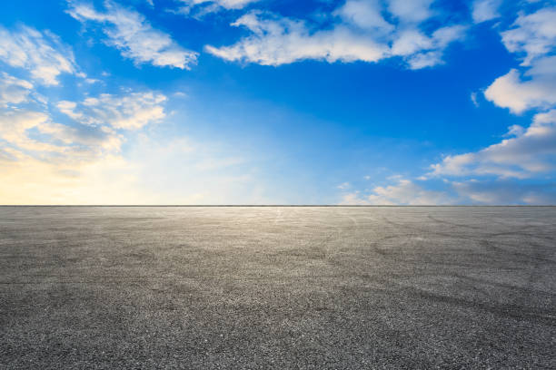 istock Car racing track square and sky beautiful clouds scenery 1058302378