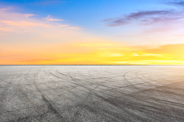 istock Car racing track square and sky beautiful clouds scenery 1058303314