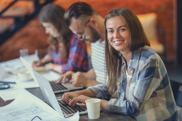 istock Smiling girl with laptop 1058305956