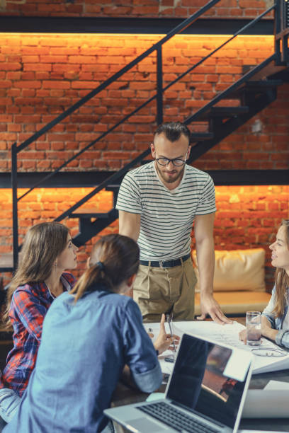 istock Young business people at meeting 1058306016