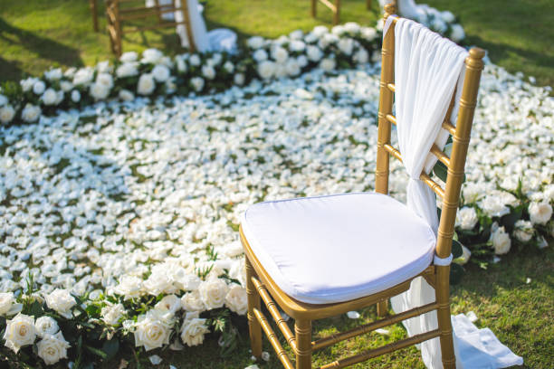 istock Chair decorated with flowers in Wedding ceremony. 1058308868