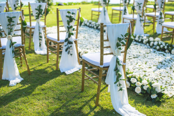 istock Chair decorated with flowers in Wedding ceremony. 1058308928