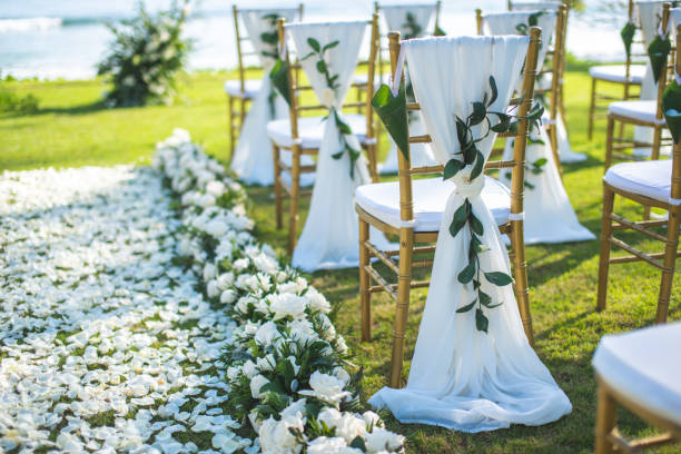 istock Chair decorated with flowers in Wedding ceremony. 1058309076