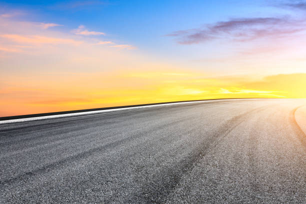 istock Asphalt road and beautiful sky scenery at sunset 1058309464