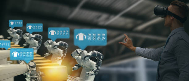 istock iot industry 4.0 concept,industrial engineer using smart glasses with augmented mixed with virtual reality technology to monitoring machine in real time.Smart factory use Automation robot arm 1058309894