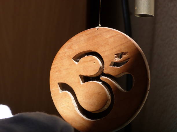 istock Wood decorative symbol in a ray of light 1058310306