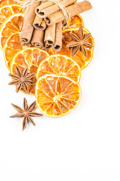 istock Dried orange slices, cinnamon and star anise isolated on white 1058310366
