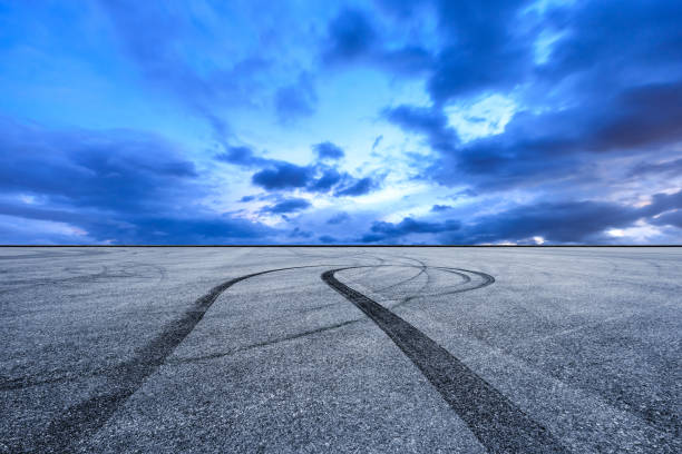 istock Car racing track square and sky beautiful clouds 1058311868