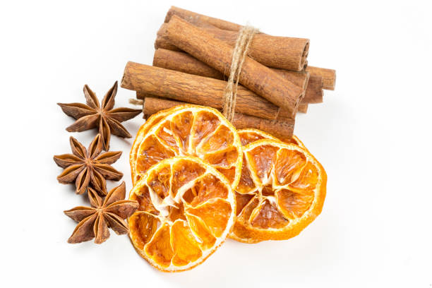 istock Dried orange slices, cinnamon and star anise isolated on white 1058311942