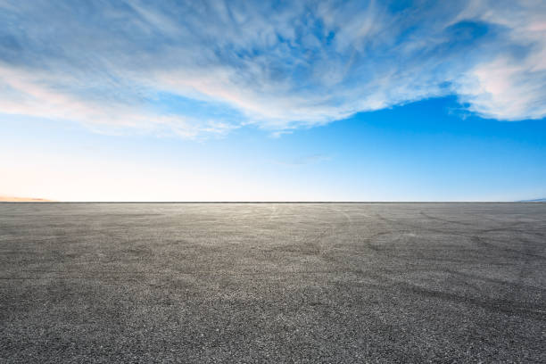 istock Car racing track square and sky beautiful clouds 1058312088