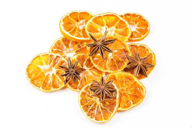 istock Dried orange slices, cinnamon and star anise isolated on white 1058312108