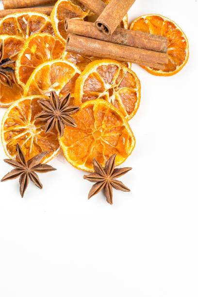 istock Dried orange slices, cinnamon and star anise isolated on white 1058312162
