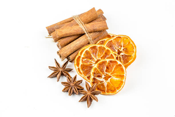 istock Dried orange slices, cinnamon and star anise isolated on white 1058312274