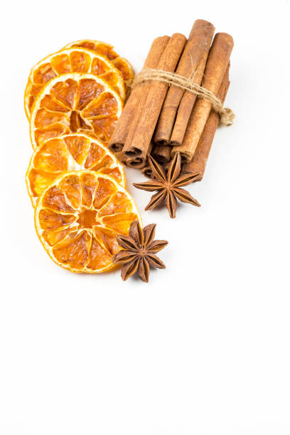 istock Dried orange slices, cinnamon and star anise isolated on white 1058312526