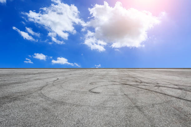 istock Car racing track and blue sky with white clouds on a sunny day 1058318888