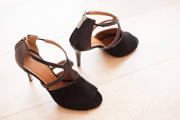istock Women Luxury High Heels Isolated on Wooden Surface 1058320166