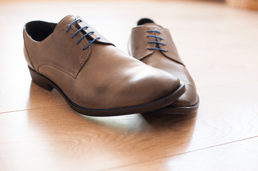Beige Elegant Man Oxford Shoes on Wooden Surface