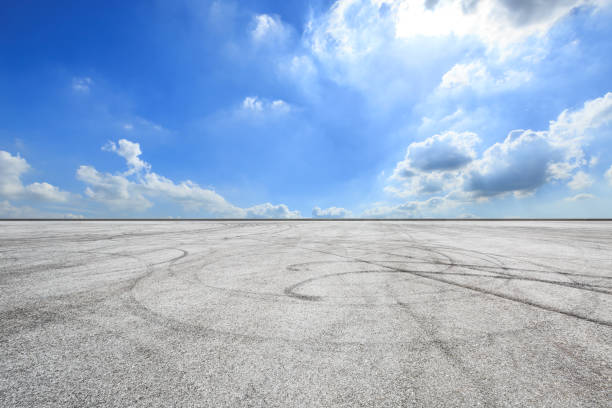 istock Car racing track and blue sky with white clouds on a sunny day 1058322200