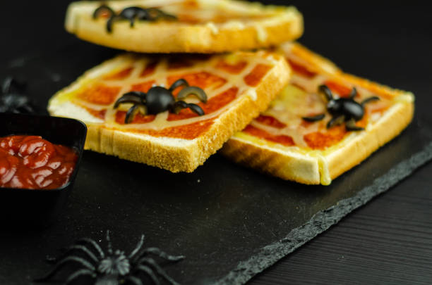 istock Funny sandwiches with  spider and  spider web for Halloween party 1058327002