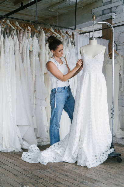 Fashion designer creating gowns