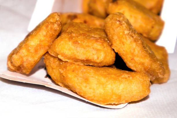 istock Pile of fried crispy chicken nuggets 1058327854