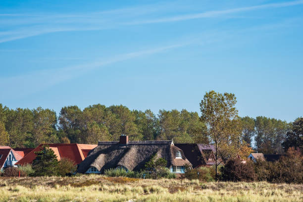 istock Buildings with blue sky in Wustrow, Germany 1058331634