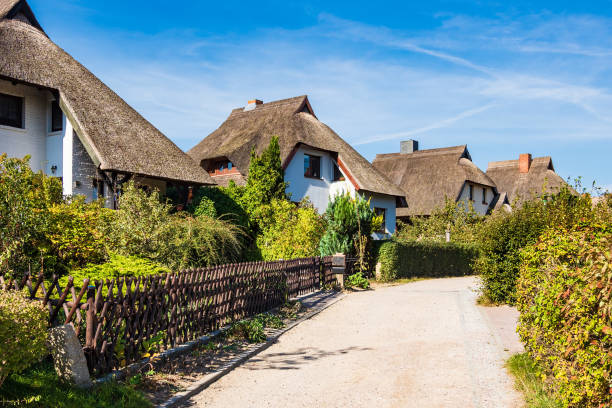 Thatched houses with blue sky in Ahrenshoop, Germany.