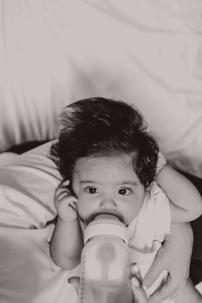 istock Young mother is feeding her baby 1058333726