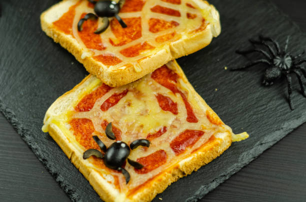 istock Funny sandwiches with  spider and  spider web for Halloween party 1058333760
