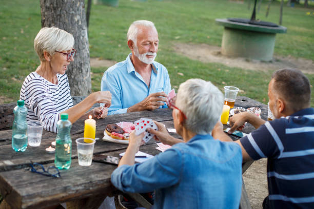 istock Senior people playing cards game 1058336470