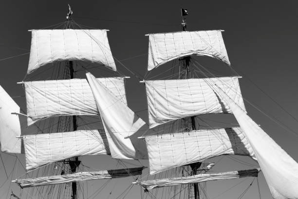 istock Classic sailing tall ship mast with sails in black and white 1058337898