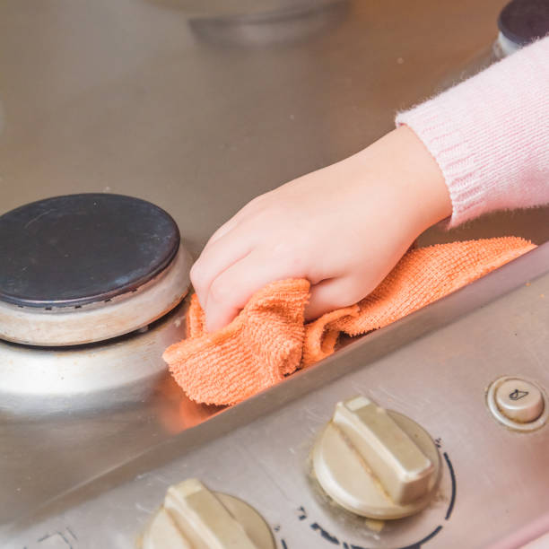 istock child washes stove for cooking, in the kitchen 1058339394
