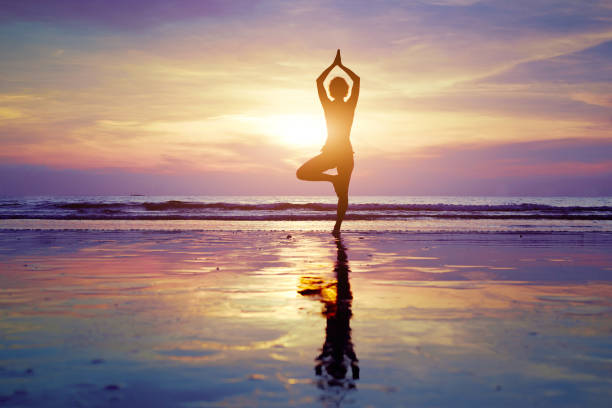 istock yoga on the beach 1058341228